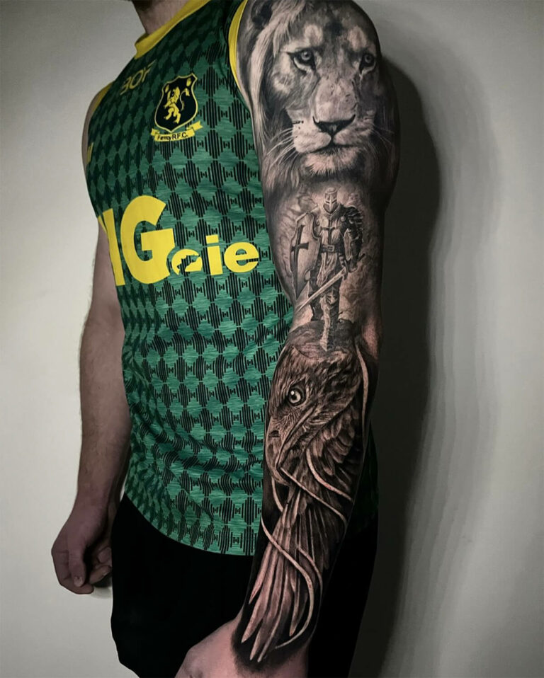 Black and grey realism full arm sleeve tattoo with lion, hawk, and soldier