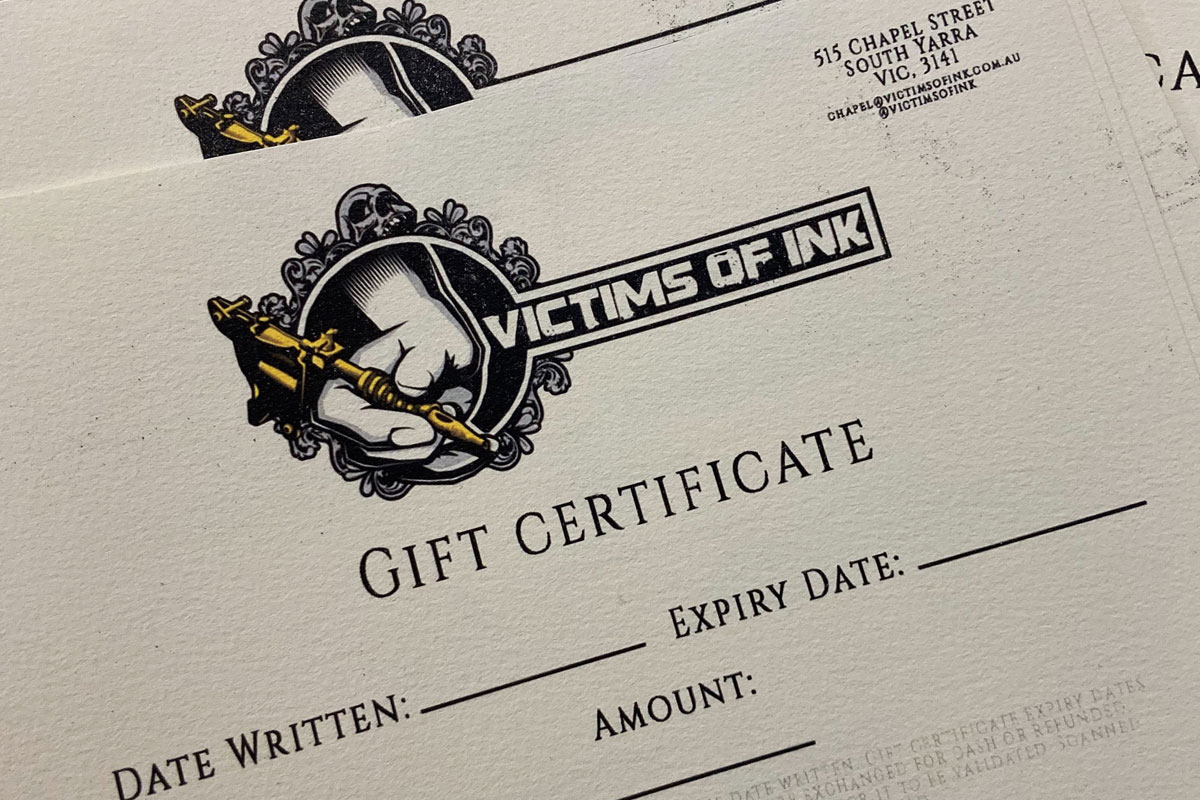 Gift certificate from Victims of Ink with tattoo logo, contact info, and fillable details.