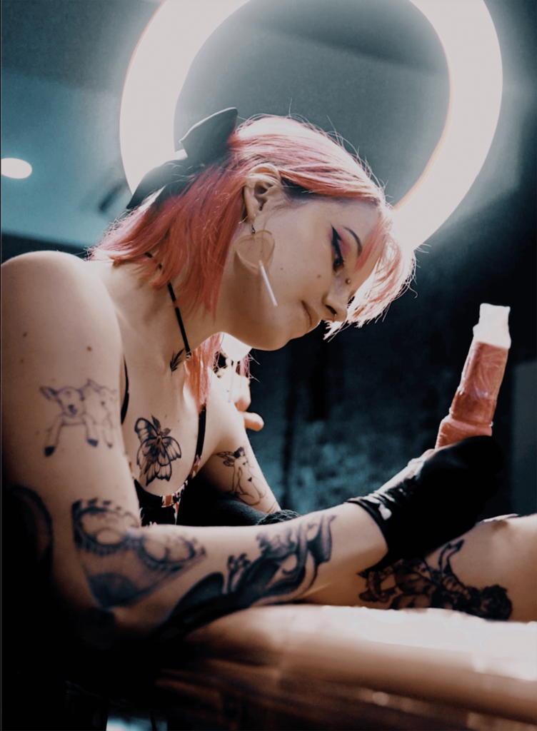 Female tattoo artist Melbourne tattooing arm