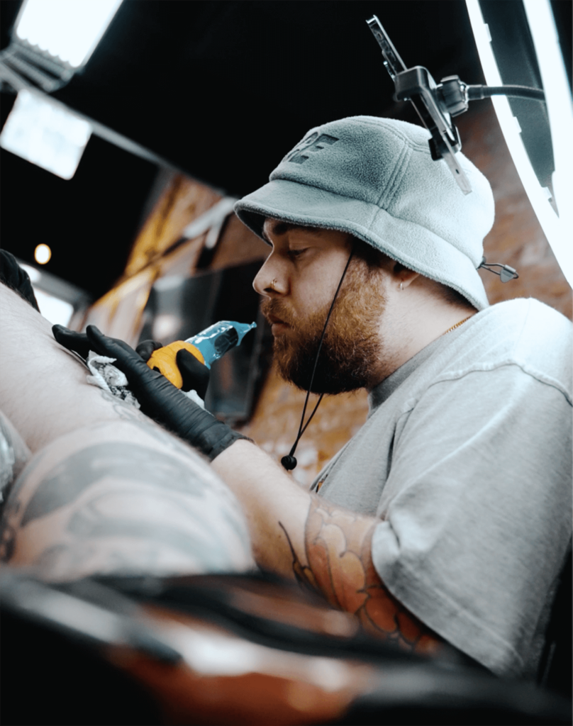 Male tattoo artist Melbourne tattooing leg