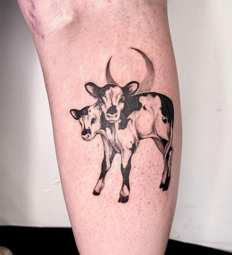 Black and grey tattoo of two-headed cow with crescent moon