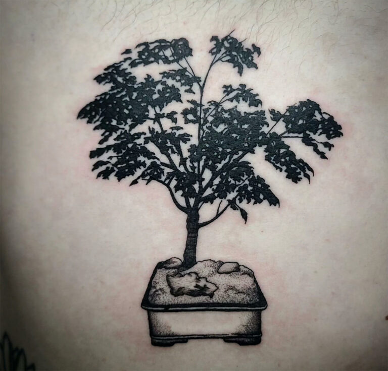 Black and grey tattoo of a bonzi tree in a square planter