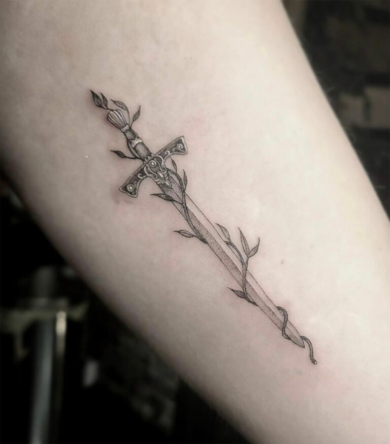 Small, fineline black and grey tattoo of a dagger with a vine wrapped around it