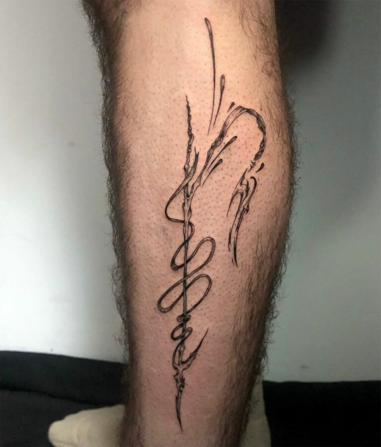 Leg tattoo with abstract design of thin, flowing lines, intricate curves, and artistic pattern.