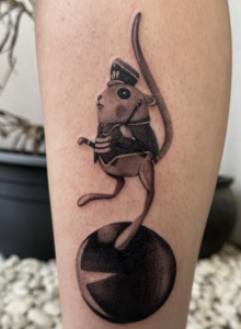 Black/grey tattoo of the Circus Mouse from Coraline 