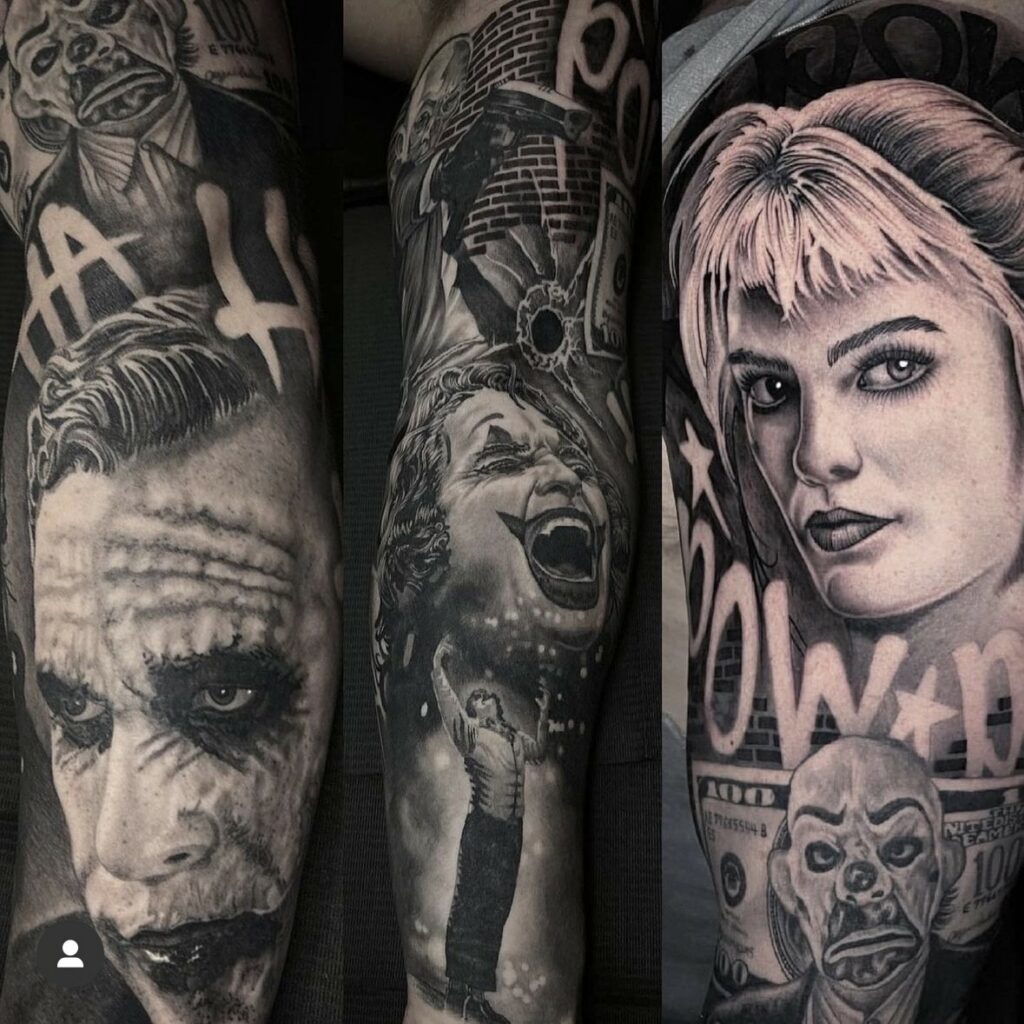 Detailed black and grey tattoos on arm, featuring stylized portraits and comic-inspired scenes.
