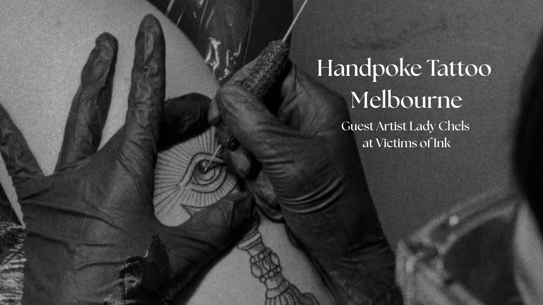 Person applying handpoke tattoo with eye design, Melbourne guest artist event at Victims of Ink.
