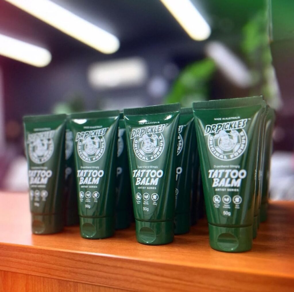 Dr Pickles tattoo balm tubes displayed on wood, Australian-made, 50g each.