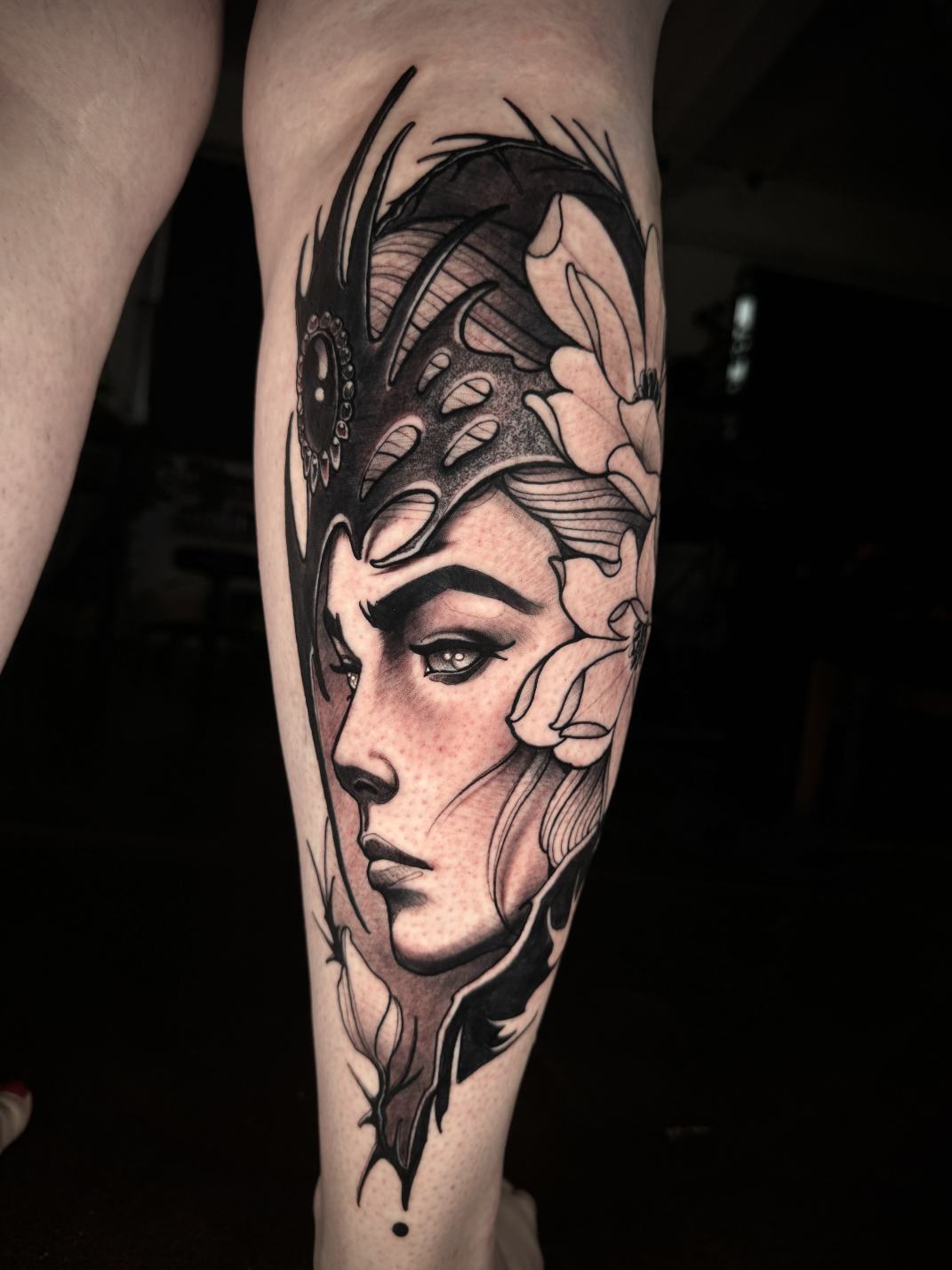 Black and grey woman tattoo by Tim Tavaria.