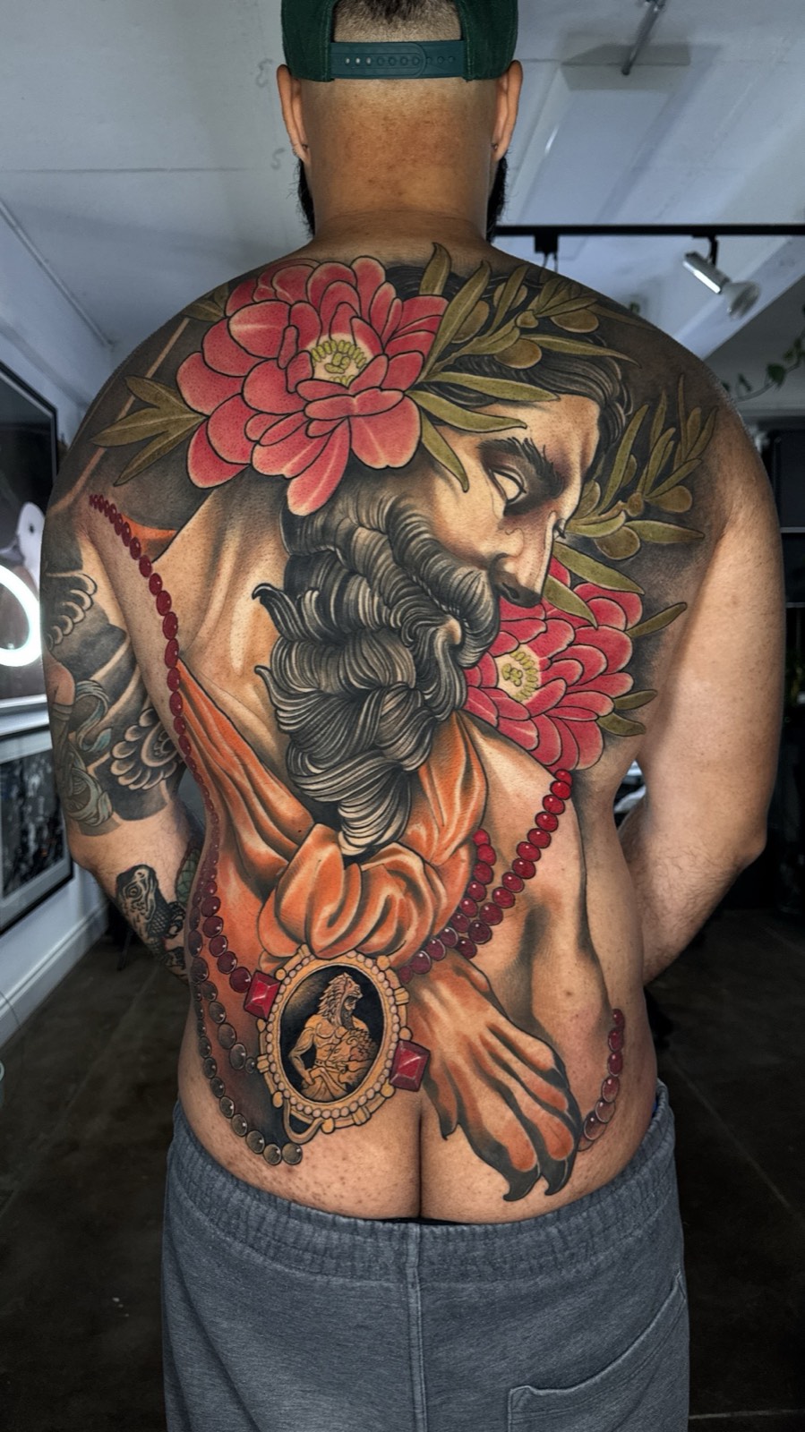 Colour back piece tattoo by Tim Tavaria.