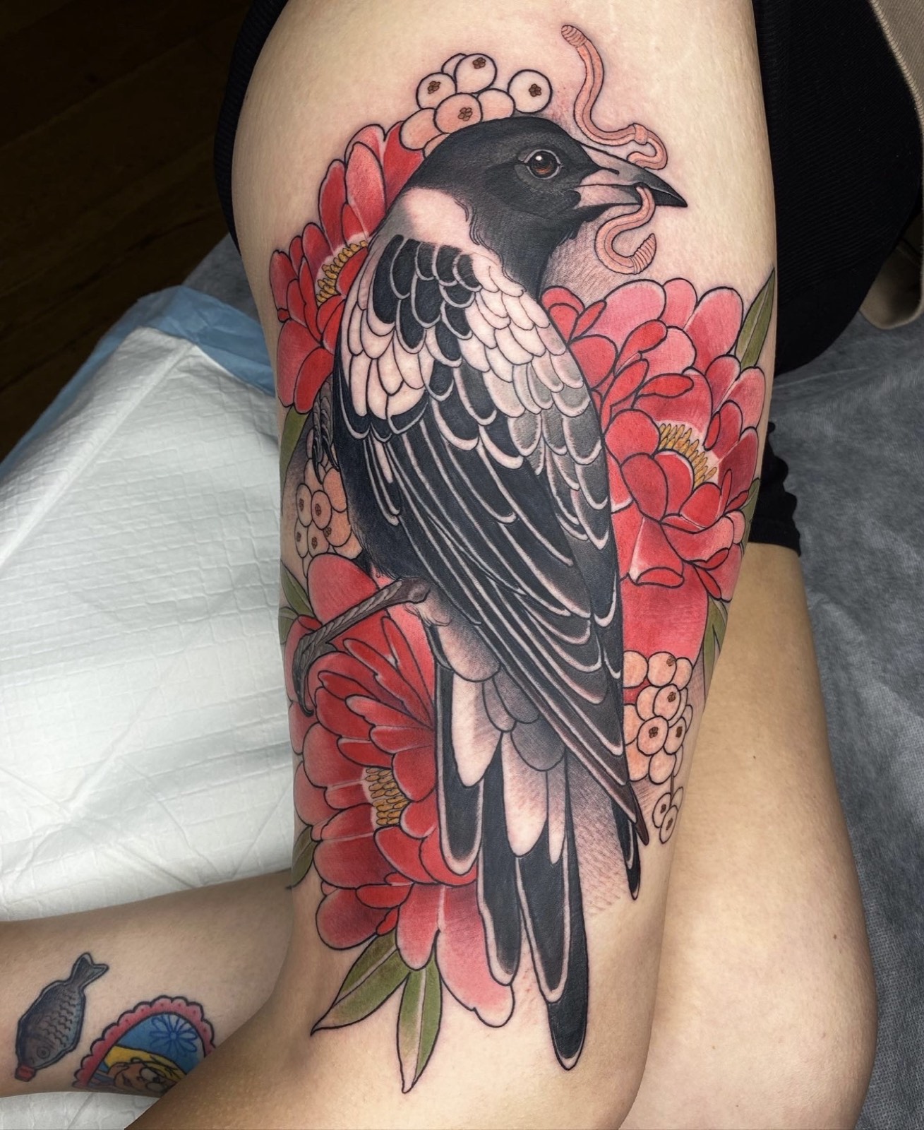 Colour bird floral tattoo by Tim Tavaria.