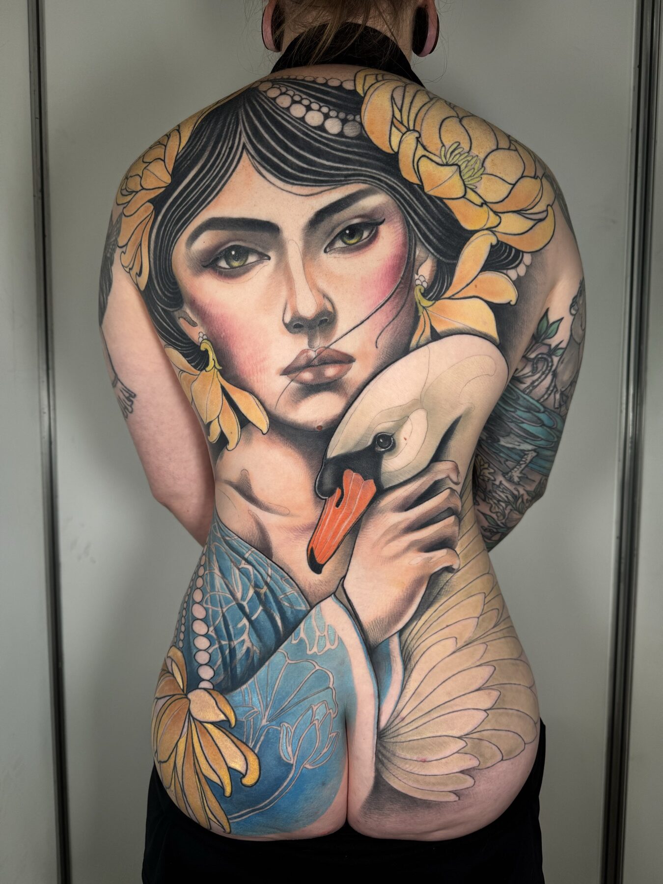 Colour woman flowers tattoo by Tim Tavaria.