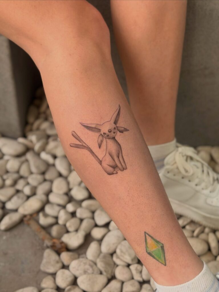 Fine-line low-poly Espeon tattoo by Chanelle Pititto at Victims of Ink