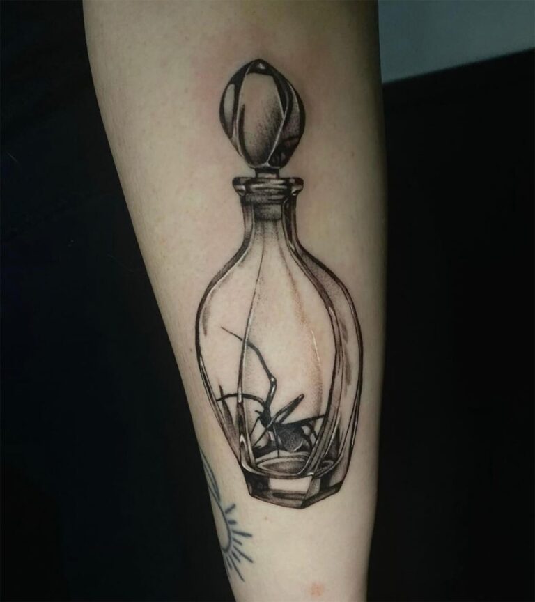 Black and grey realism tattoo of a spider in a glass decanter