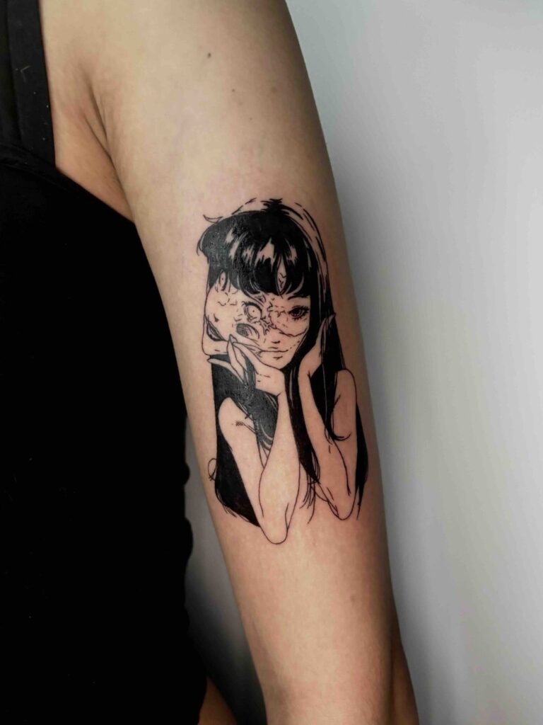 Stylised tattoo of a person with long hair and a partial mask design on an arm.