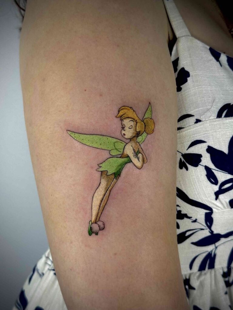 Green-winged fairy fantasy tattoo on arm