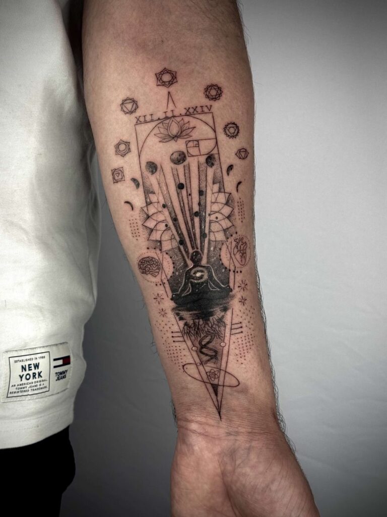 Celestial geometric forearm tattoo with planets, stars and fine line details