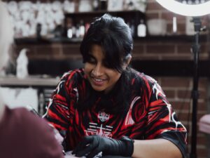Khash tattooing a client at Victims of Ink in South Yarra