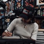 Tanya drawing tattoo designs at Victims of Ink in South Yarra, Melbourne
