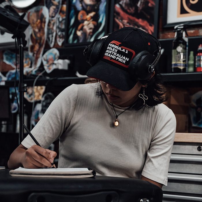 Tanya drawing tattoo designs at Victims of Ink in South Yarra, Melbourne