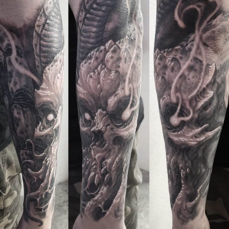 Black and grey realism horror skull creature bioorganic forearm sleeve tattoo