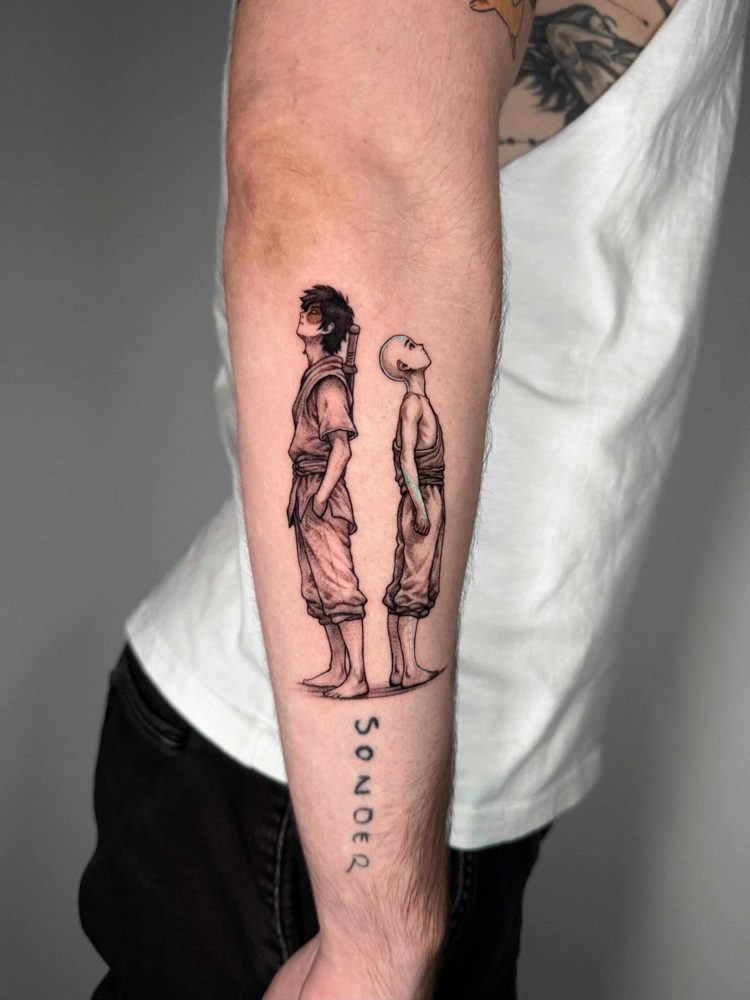 Fine line tattoo of two anime characters standing back to back on a forearm by Woody