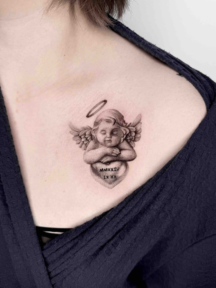 Shaded cherub with wings and a heart tattoo on the upper chest by Woody